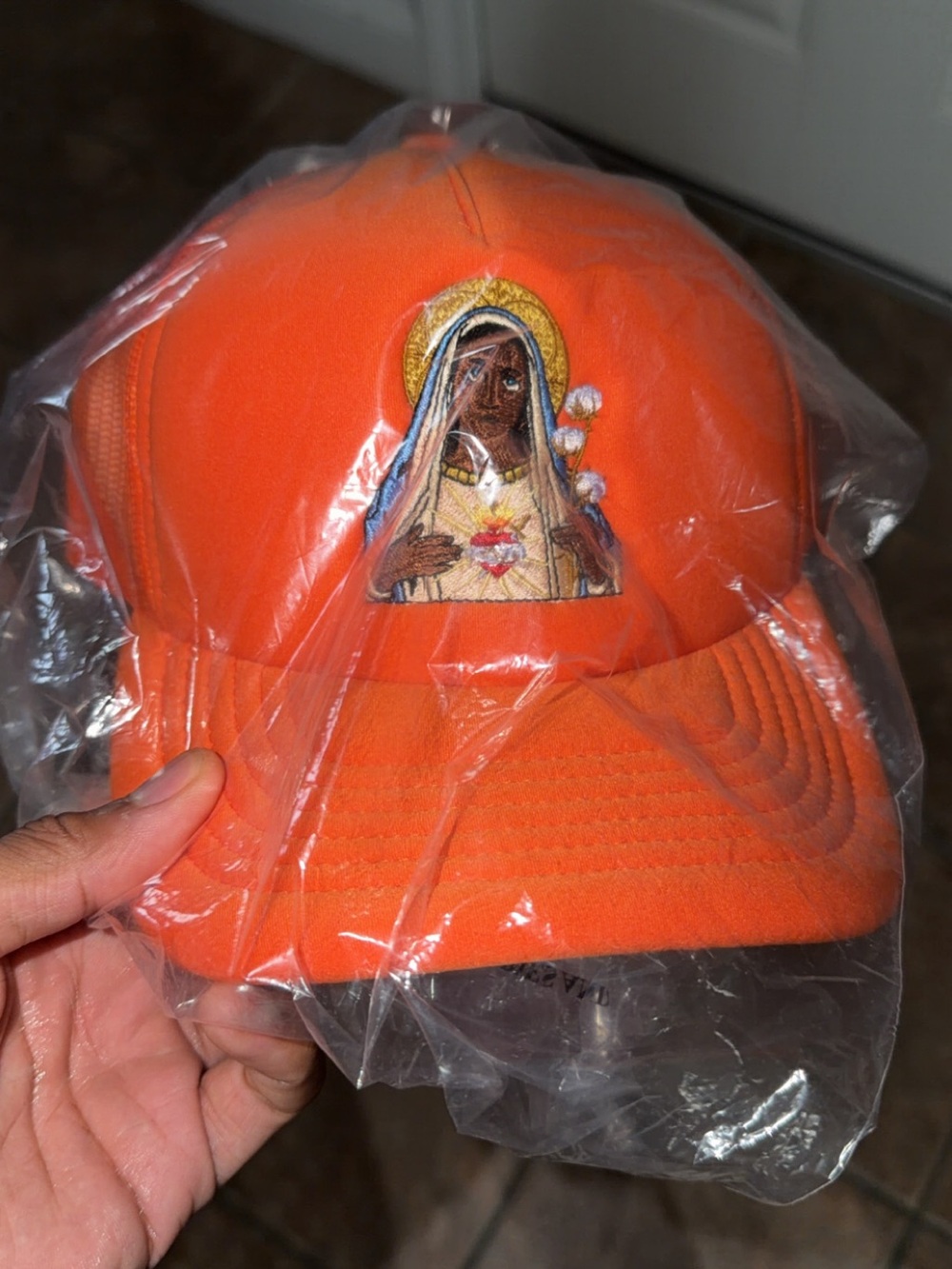 Denim Tears Black Madonna Orange Trucker Hat